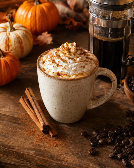 Pumpkin Spice latte with whipped cream and cinnamon